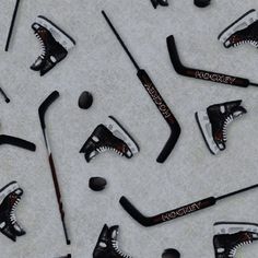 an image of ice hockey equipment on the ground in various positions and sizes for use