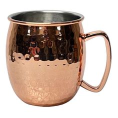 a large copper colored mug with handles