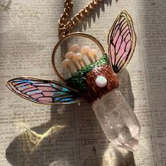 Looking for a magical iridescent fairy wing mushroom necklace?🍄 Then you found just the one, this fairy wing mushroom pendant is a perfect gift for a mushroom lover, fairy lover, and cottage core lover.   - the necklace is approximately 2.5 inches L , 2.5 inches W. - the fairy wings are hand drawn and made by me.  - hand sculpted mushrooms with sculpey clay , clay tools, and my magic hands💗✨ - hand painted with acrylics  - comes with nickel free gold chain that is approximately 18-19 inches lo Fairycore Jewelry With Butterfly Charm For Gifts, Fairycore Butterfly Necklace Gift, Fairycore Butterfly Charm Necklace Gift, Fairycore Butterfly Charm Necklace For Gift, Fairycore Necklace With Butterfly Charm For Gift, Iridescent Fairy, Fairy Mushroom, Clay Mushroom, Cottagecore Jewelry