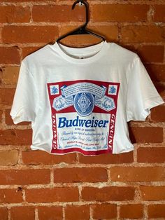 True to fit. 100% Cotton. Budweiser Shirt Outfit, Loose Crop Top Outfits, Bud Weiser, Beer Crop Top, Yeehaw Outfits, Fair Week, Budweiser Shirt, Crop Top Fits, Loose Crop Top