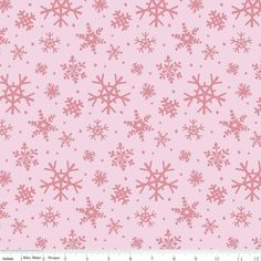 a pink background with snowflakes on it