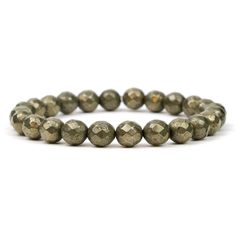 Natural Pyrite 8mm faceted beads Approx. 7.5" Strung on high quality rubber elastic Handcrafted at Beads Of Paradise NYC Pyrite is a metallic mineral that derives from iron. Because of its color, it has also been given the nickname, “fool’s gold.” Most Pyrite comes from the United States, although it is also found across Europe. Pyrite is usually found associated with other sulfides and oxides and is found in quartz veins, coal beds and even sometimes in fossils. Despite being nicknamed fool's g Spiritual Faceted Round Beads Stretch Bracelet, Spiritual Stretch Bracelet With Faceted Round Beads, Fool’s Gold, Faceted Bead, Paradise, United States, Elastic, Bracelet, Beads