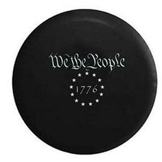 a black frisbee with white writing on it and stars in the bottom corner