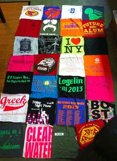 many t - shirts are laid out on the floor