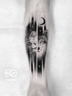 a man's arm with a wolf and moon tattoo on it