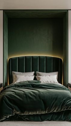 a large green bed with white pillows in a room