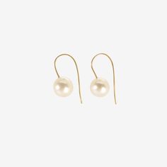 Details Rosanne Pugliese 18k yellow gold & cream-colored South Sea pearl earrings on minimalist ear wires. The pearls measure 7/16" x 7/16"(11mm) & the earrings measure approximately 1″ from the top of the minimalist ear wire to the bottom of the pearl. - 7/16" (8mm) diameter South Sea pearls - 18k yellow gold - 1" total length - each earring weighs 2.61g Formal Akoya Pearl Earrings With Ear Wire, Classic 14k Gold Pearl Earrings With Ear Wire, Single Yellow Gold Pearl Earring, Elegant Yellow Gold Pearl Earrings With Ear Wire, Classic Yellow Gold Pearl Earrings With French Hook, Gold Akoya Pearl Earrings With Ear Wire, Gold Round Pearl Earrings With French Hook, South Sea Pearls Earrings, Sea Pearl