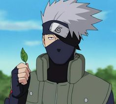 a man with white hair wearing a black mask and holding a green leaf in his hand