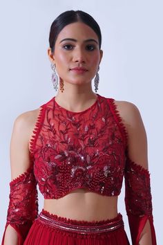 Maroon attached cancan gathered pleated lehenga with tri-tiers and loop sequin embellished waistline. Paired with a halter neck padded blouse with all over rafflesia bloom embroidery using tonal sequins, beads and pearls highlights and cold shoulder flowy wing sleeves detailing. - Aza Fashions Cold Shoulder Top Pattern, Ghaghara Choli, Lehenga Outfits, Tiered Lehenga, Drama Clothes, Pleated Lehenga, Bloom Embroidery, Choli Dress, Wing Sleeves