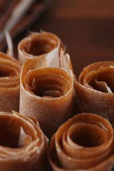 rolled up brown paper sitting on top of a wooden table