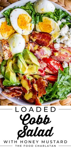 the loaded cobb salad with bacon, avocado and eggs is shown on a white plate