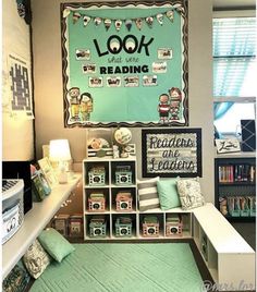 a room with bookshelves, shelves and pictures on the wall in front of it