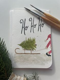 a christmas card with the words ho hoo on it next to some pine branches