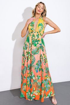 Indulge in the timeless elegance of our woven maxi dress, printed with a charming halter neckline and a full, flowing skirt. The plunging back and delicate neck tie add a touch of sophistication to this exquisite piece. Details:Self : 100% PolyesterLining : 100% PolyesterSize & Fit- Model is 5`8" And Wearing Size Small- Measurements Taken From Size Small- Approx. Length: 60" Orange Sleeveless Tie-back Maxi Dress, Orange Sleeveless Maxi Dress With Tie Back, Sleeveless Orange Maxi Dress With Tie Back, Floor-length Halter Dress For Spring Vacation, Spring Orange Tie-back Maxi Dress, Orange Halter Neck Maxi Dress For Spring, Tropical Multicolor Halter Neck Maxi Dress, Multicolor Tie Back Maxi Dress For Garden Party, Multicolor Maxi Dress With Tie Back For Garden Party