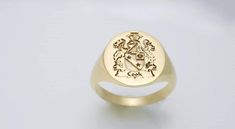 gold family crest signet ring delicately engraved with your family crest, family coat of arms or any other image or initials you want ♡  the ring has solid back. deep and detailed engraving very delicately handcrafted unisex - looks super cool on both women & men  side or inside engravings cost 12 USD for both sides.  please contact us if you request side/inside engravings or simply go back to our shop and purchase the "Side or inside engraving fee" listing. this gold family crest signet ring is Mens Gold Signet Rings, Cremation Jewelry Ring, Wax Seal Ring, Mens Signet Ring, Family Crest Rings, Custom Signet Ring, Mens Pinky Ring, Family Coat Of Arms, Rings Mens