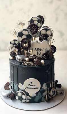 a black and white cake with lots of decorations