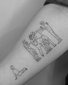 a man's arm with an outline of three people doing different things on it