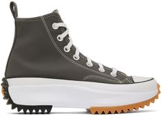 High-top canvas sneakers in gray. · Rubber cap toe · Lace-up closure · Logo bonded in white and black at inner side · Pull-loop at heel · Padded mesh lining · Foam rubber platform midsole with rubberized logo at heel · Treaded rubber outsole in black and tan · Platform: H1.75 in Supplier color: Iron grey/Black/White | Converse Gray Run Star Hike Sneakers Sneaker Boots Mens, Converse Run Star Hike Platform, Black And White Converse, Converse Run Star Hike, Converse Run, Run Star Hike, Converse Run Star, Platform Converse, Sneakers Womens