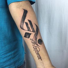 a person with a tattoo on their arm