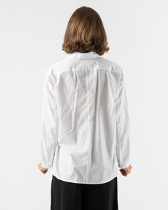 Toogood Draughtsman Shirt in Poplin Chalk. Square cut shirt with an intentionally oversized fit. Featuring buttoned cuffs, drop shoulders and a neat pointed collar. Unisex 100% Cotton Made in the EU Machine Wash Coral is 5'7 and wearing an XS Toogood London based design studio, Toogood was founded by Faye Toogood. Her work is cross-disciplinary and stems across interiors, furniture, homeware and fashion. She cross-pollinates on every project working with sculptures, architects and artists to cre Unstructured Shirt With Spread Collar For Daywear, Relaxed Fit Cotton Dress Shirt For Office, Collared Dress Shirt In Relaxed Fit For Daywear, Relaxed Fit Shirt With Concealed Placket, Modern Cotton Dress Shirt For Daywear, White Poplin Shirt For Work, Relaxed Fit Poplin Top For Work, Modern Button-up Shirt For Daywear, Cotton Shirt With Cuffed Sleeves And Fold Down Collar