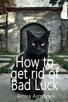 a black cat sitting in front of a brick building with the words how to get rid of bad luck written on it