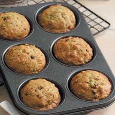 muffins in a pan sitting on top of a counter