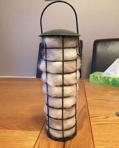 a bag of white balls sitting on top of a wooden table