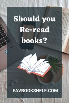 an open book sitting on top of a table next to a laptop