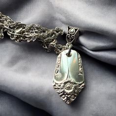 This Starlite vintage spoon handle pendant is made from  vintage flatware, It is suspended from a chain in your choice of length. The pendant measures about 1.5 inches. Packaged in a fabric organza bag and tied with satin ribbon. Ready to give or keep for yourself.  Imagine how fabulous you will look and feel wearing this unique piece. *Please remember these are vintage silver plate silverware and may show some signs of wear and tear. Thank you for shopping handmade and supporting my small business. I sincerely appreciate it. Upcycled Spoons, Spoon Necklace, Vintage Flatware, Silverware Jewelry, Vintage Spoons, Silver Flowers, Jewelry Vintage, Organza Bags, Necklace Silver