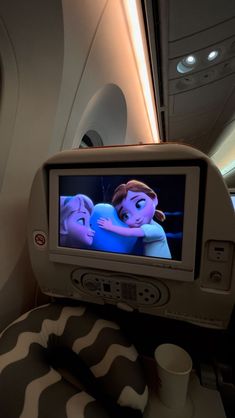 an airplane with two people on the screen