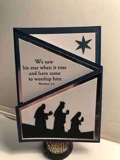 a card with the silhouettes of three people and a star on it that says, we saw his star when it rose and have come to worship