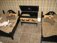 two beds with dogs on them in a room that has plaid walls and tile flooring