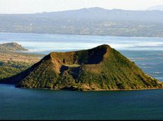 an island in the middle of water surrounded by land and mountains with text that reads gopack up