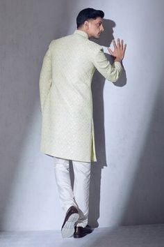 Multicolored sherwani with scallop thread, sequin embroidery and statement buttons. Paired with a pant. - Aza Fashions Fitted Sherwani With Gota Work For Eid, Semi-stitched Cutdana Sherwani For Diwali, Festival Sherwani With Cutdana Semi-stitched, Luxury Semi-stitched Ceremonial Sherwani, White Semi-stitched Sherwani With Cutdana, Ceremonial Long Sleeve Semi-stitched Sherwani, Sequin Embroidery, Satin Color, Sequins Embroidery