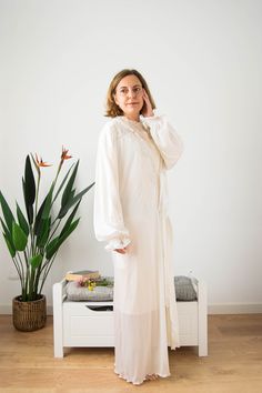 "West Germany vintage long dressing gown in ivory with lace on the V neckline and the long sleeves. It's a very well done dressing gown, in excellent condition. It's soft and supple, satined (made of polyamide) with a silky finish. The cuffs have an elastic and are flared and decorated with two ribbon trims. It's very flowy and semisheer and closes only with a front bow. In awesome condition. This dressing gown will fit for several sizes. Please see measurements below. * Adding garments or jewel Bridal Dressing Gown, Poet Sleeve, Gown Vintage, Long Gown Dress, Womens Robes, Dressing Gown, Well Done, West Germany, Ribbon Trim