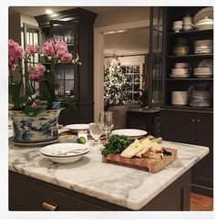 a kitchen counter with plates and bowls on it