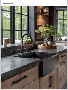 an image of a kitchen setting with black counter tops and wooden cabinets in the background