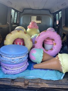 there are many doughnuts and donuts in the back of this truck bed