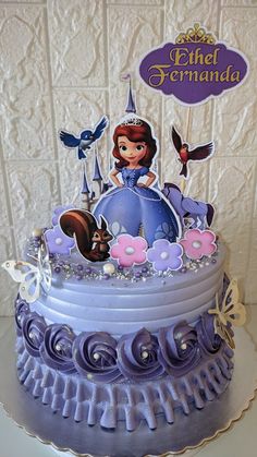 there is a purple cake with princess on it