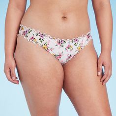 This Ruffle Cheeky Bikini Bottom from Shade & Shore™ is adorned with a ditsy floral print for extra charm. It features a low-rise, hipster silhouette with soft ruching and ruffles on the edging for a sweet finish. The stretchy fabric with elastic at the leg openings provides comfortable movement, and the opaque construction offers coverage for confident wear. Pair them with a coordinating bikini top to complete your swim style. Shade & Shore™: Found exclusively at Target. Feminine Stretch Swimwear With Floral Print, Feminine Floral Print Stretch Swimwear, Feminine Stretch Floral Print Swimwear, Summer Swimwear With Lace Trim Briefs, Summer Swimwear With Lace Trim And Brief Shape, Swim Style, Shades For Women, Ditsy Floral Print, Photography Lighting