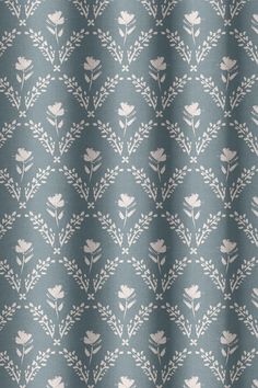 a blue and white floral pattern on fabric