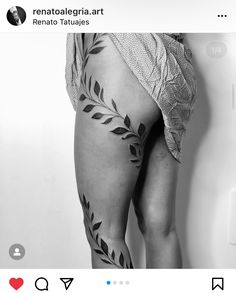 a woman's leg with leaves on it and the bottom part of her thigh