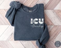 Personalized ICU Nurse Sweatshirt, Custom ICU Nurse Sweatshirt, ICU Nurse Gift, Nurse Appreciation Gift, Critical Care Nurse Shirts ✧ SIZING ✧ ⋒ Please check our size chart before placing an order. ⋒ If you want an oversized look, pick a sweatshirt that is 2 sizes larger than your usual size. ✧ IMPORTANT NOTE: We try to depict all shirt and design colors as close to the original as possible but depending on your screen settings or the shirt color you chose, the colors of the graphics may vary sl Bliss Products, Critical Care Nurse, Nurse Sweater, Critical Care Nursing, Nurse Shirts, Nurse Appreciation Gifts, Er Nurse, Nurse Sweatshirt, Nurse Appreciation