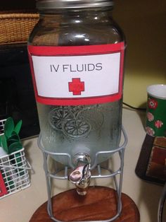 a glass jar filled with liquid sitting on top of a table