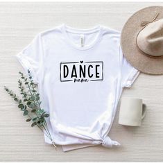 "Dance Mama Shirt, Dance Mom T-Shirt, Gift For Dance Mama, Dance Lover Mom Shirt, Mothers Day Gift Shirt, Funny Mommy Tee, Cute Mama Shirt ☀️☀️☀️☀️☀️ Everything in our shop is hand crafted and made to order. If you want different color or size contact me! If you would like something custom made to fit your personal style please message me and I will do everything to get you that something special. ---How To Order--- ⭐️Please, check and review all photos ⭐️Choose your t-shirt size and color ⭐️Ent Dance Mama Shirt, Cotton Letter Print Tops For Dance, Cotton Tops With Letter Print For Dance, Casual T-shirt With Letter Print For Dance Class, Dance Mom Shirts Design, Hip Hop T-shirt With Letter Print For Dance Class, Summer Dance Class Crew Neck T-shirt, Hip Hop Letter Print T-shirt For Dance Class, Summer Crew Neck T-shirt For Dance Class