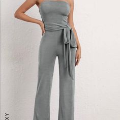 This Jumpsuit By Shein Can Be Worn In A Variety Of Ways. Causal By Day And Elegant By Night. Dark Gray, 97% Polyester, 3% Elastane. Fyi; Brand New( I Did Try It On And In My Opinion The Top Part Is A Tad Big). Still Nice But If Your Not Top Proportioned You May Have To Tighten The Wrap. Size M. Nice Fit Overall. Fitted Casual Strapless Jumpsuit For Loungewear, Wrap Jumpsuit, Shein Pants, New Me, Try It, Dark Gray, Pant Jumpsuit, Jumpsuit Romper, Overalls