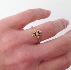 Delicate Jewelry With Center Stone For Gift, Delicate Gold Flower Ring With Gemstone, 14k Gold Flower Ring With Gemstone, Yellow Gold Flower Ring With Center Stone As Gift, Yellow Gold Flower Ring With Center Stone, Dainty Adjustable 14k Gold Flower Ring, Dainty Gold Cluster Ring With Gemstone, Gold Dainty Birthstone Ring With Center Stone, Gold Dainty Ring With Center Stone