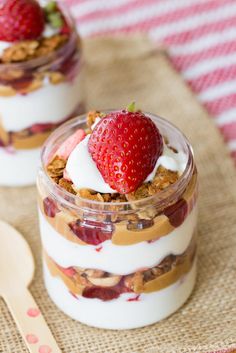 two desserts with strawberries and yogurt on top