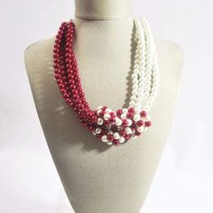 A beautiful handmade red and white color block interloop glass pearls beaded necklace. This necklace was inspired by the Delta Sorority colors. This is a unique style and design that is elegant and chic. This custom-made two colors glass pearls glass pearls women's necklace. This two colors blends to create a unique personalized style and design. {"@context":"https://schema.org/","@type":"Product","name":"Red and White Interlocking Pearls Necklace","image":"https://cdn.shopify.com/s/files/1/1069 Sorority Colors, Delta Sorority, Women's Necklace, Pearl Jewelry Necklace, Pearls Necklace, Color Blending, Petite Outfits, Pearl Beads, Sorority