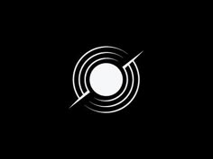 a black and white logo with an arrow in the center on a dark background,